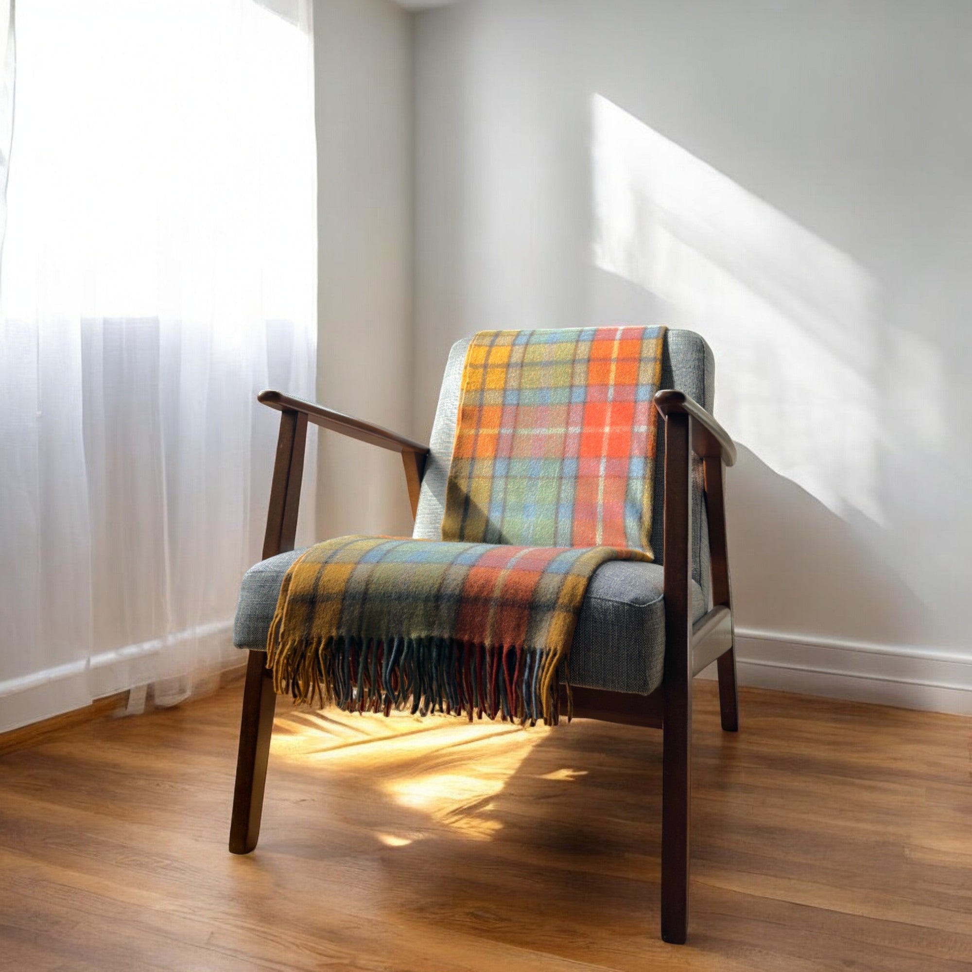 Antique Buchanan knee blanket draped over a chair in a cozy room