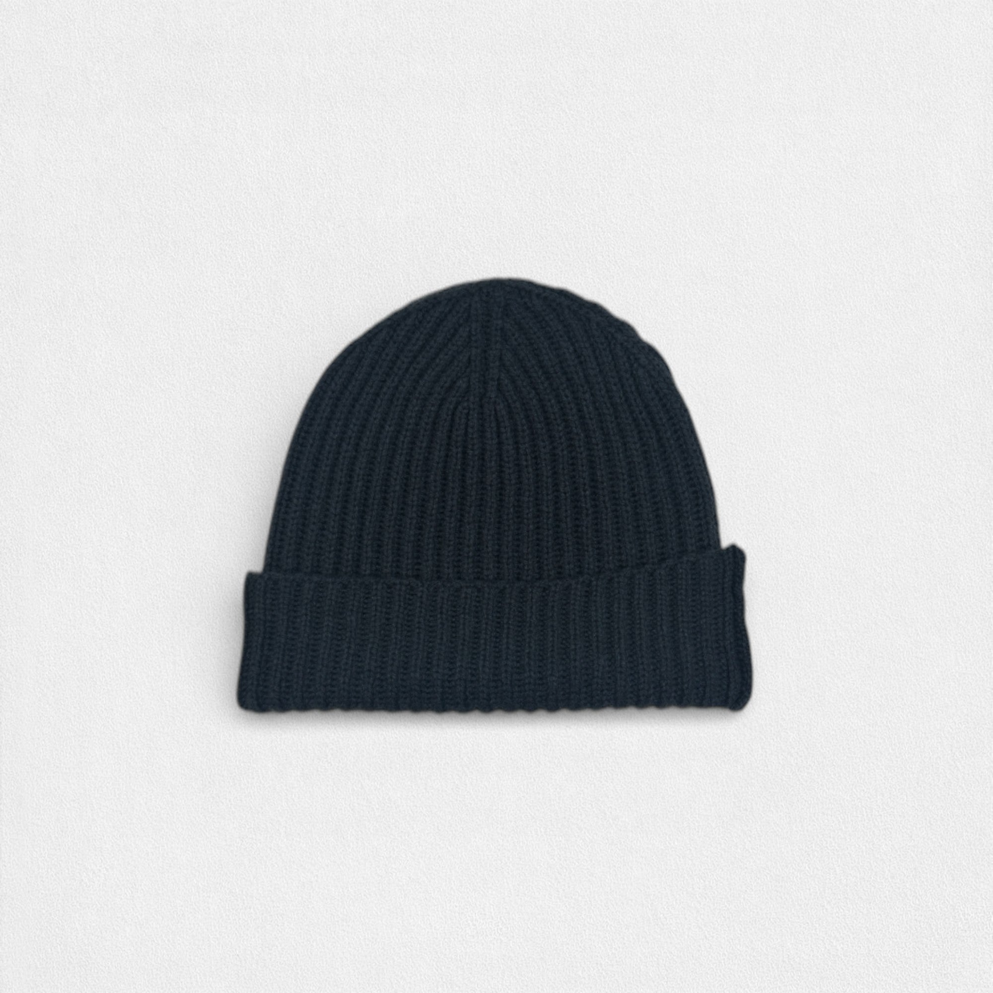 Black knit beanie on a light gray background