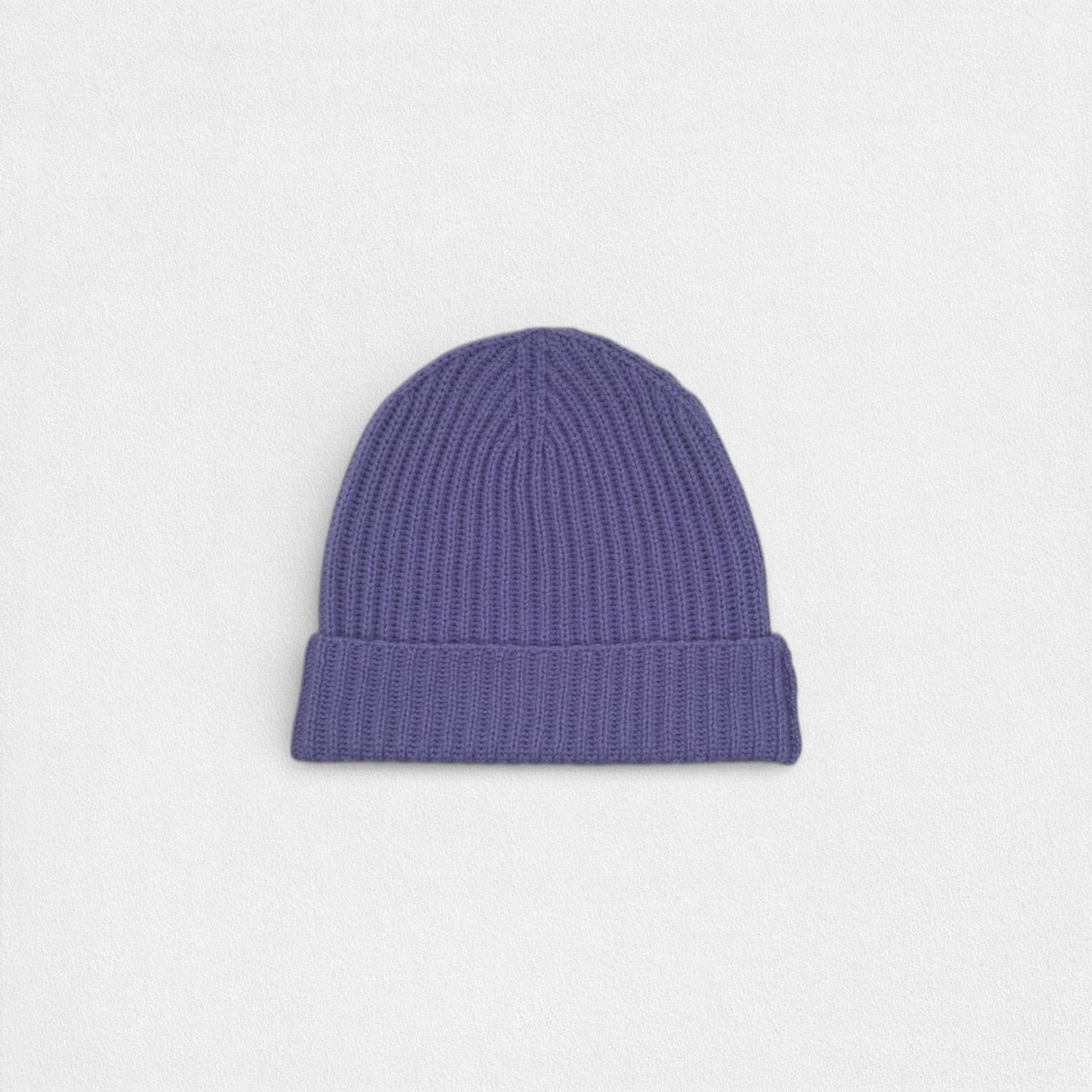 Purple knit beanie on a light gray background