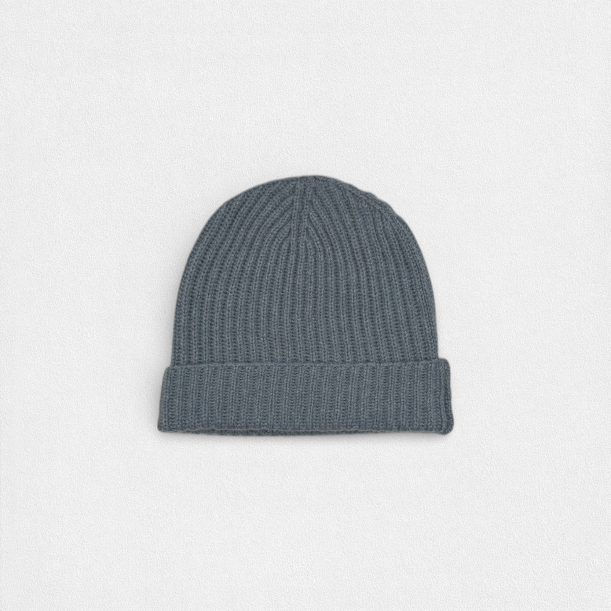 Neutral Grey tone 100% cashmere ribbed beanie on white background.