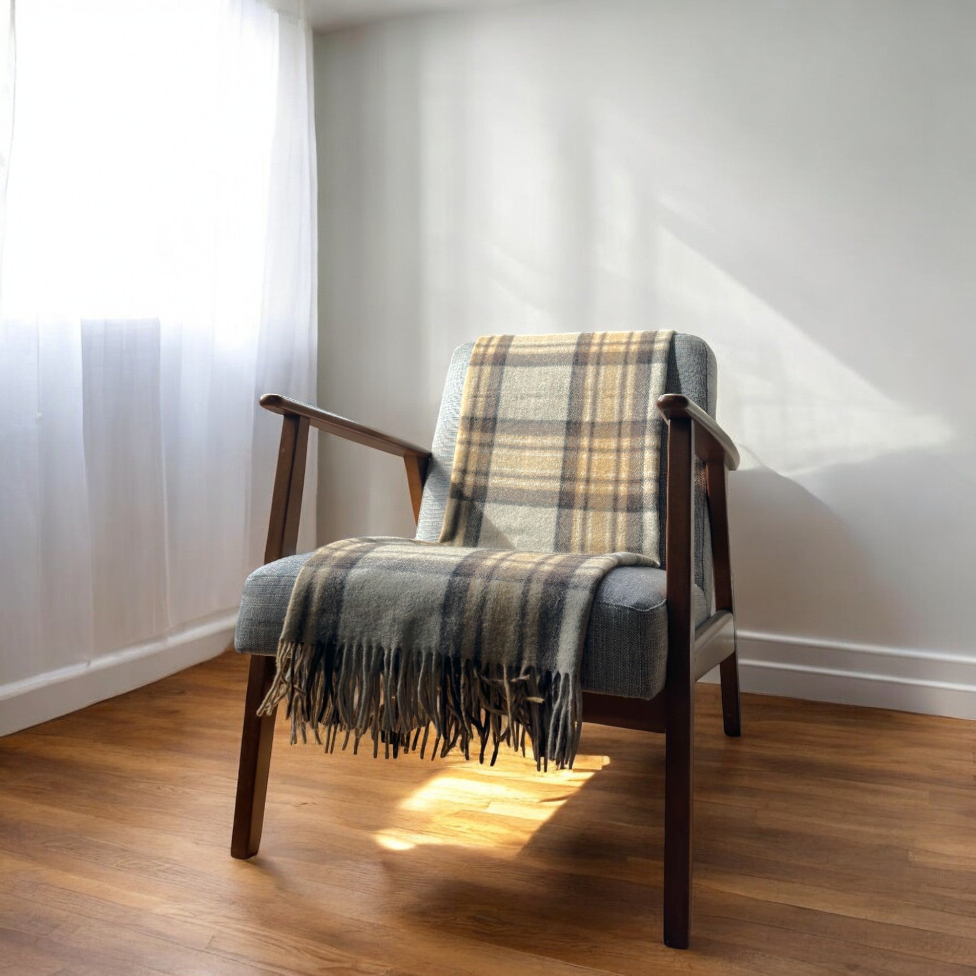 a mackellar knee blanket draped over a chair in a cosy room