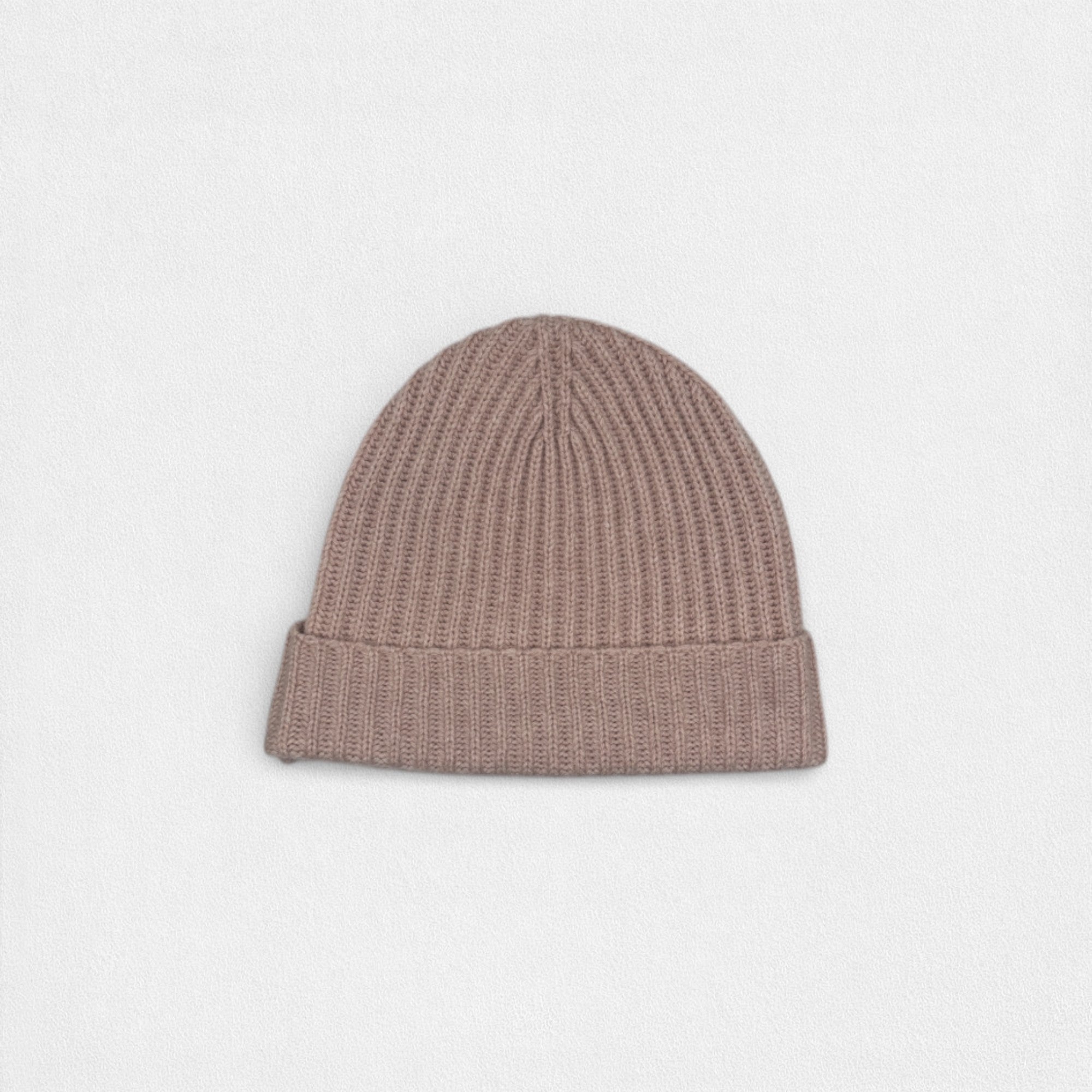 Brown knit beanie on a light gray background