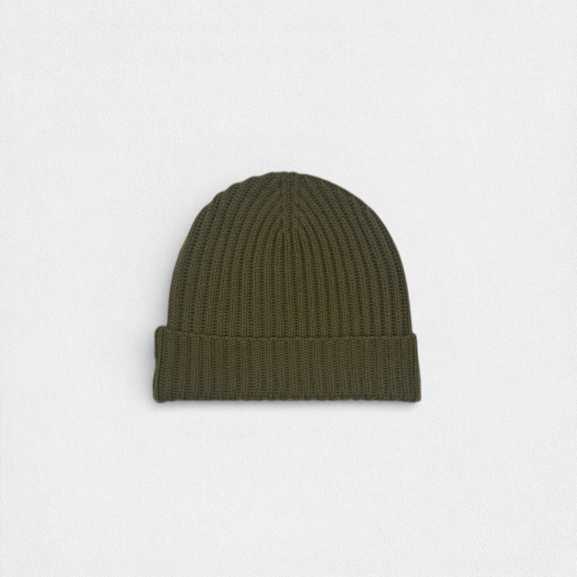 Green beanie on a light gray background