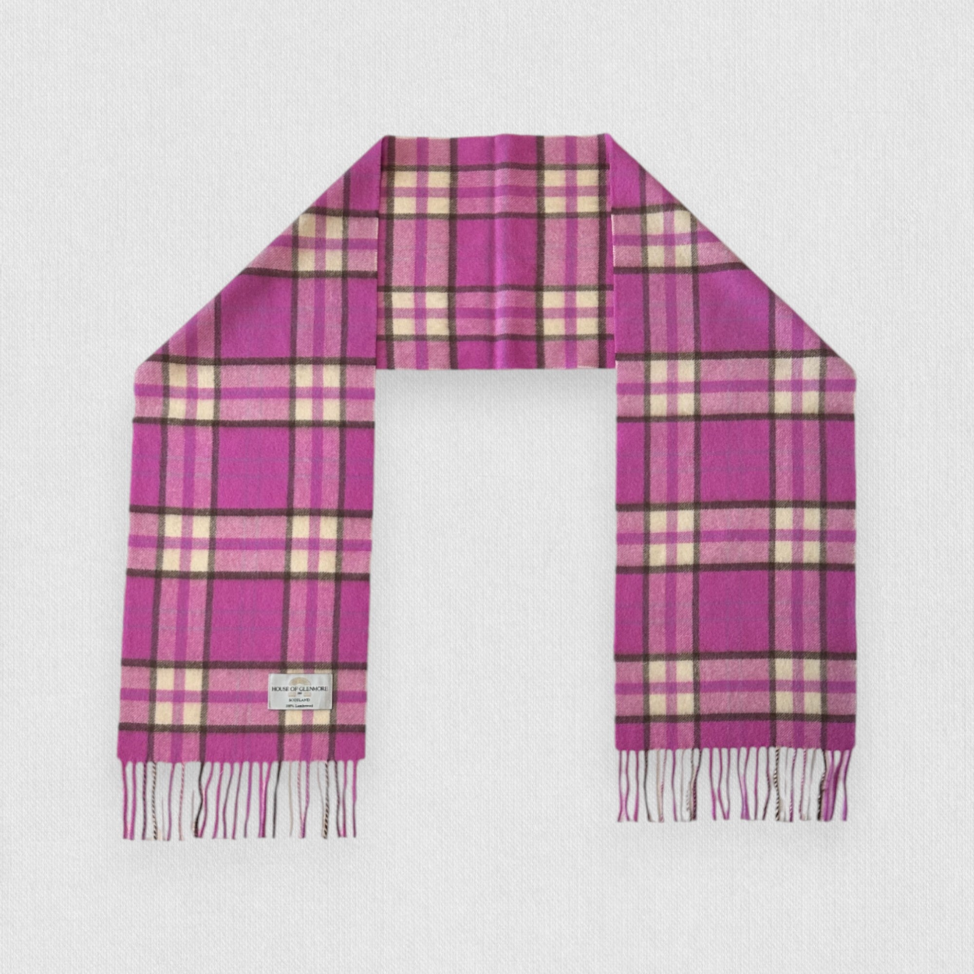 A pink check scarf made from 100% lambswool, displayed on a plain background, with fringes on the ends.