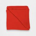 A folded red cashmere blanket displayed on a white background.